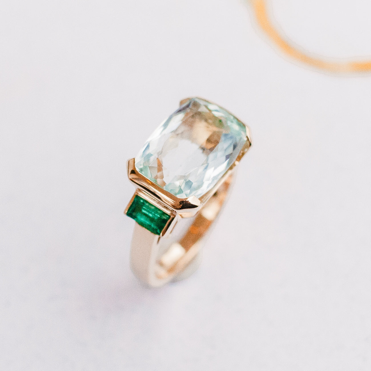 AQUAMARINE + EMERALD OPEN BEZEL RING