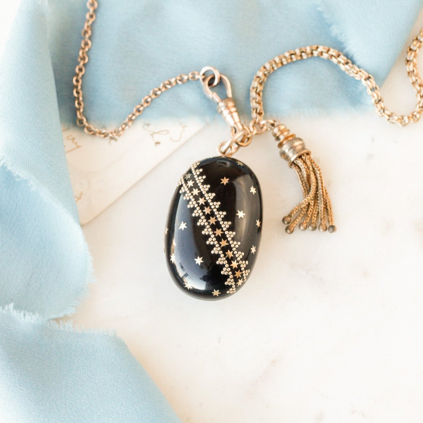 Pique Tortoiseshell Tasseled Locket