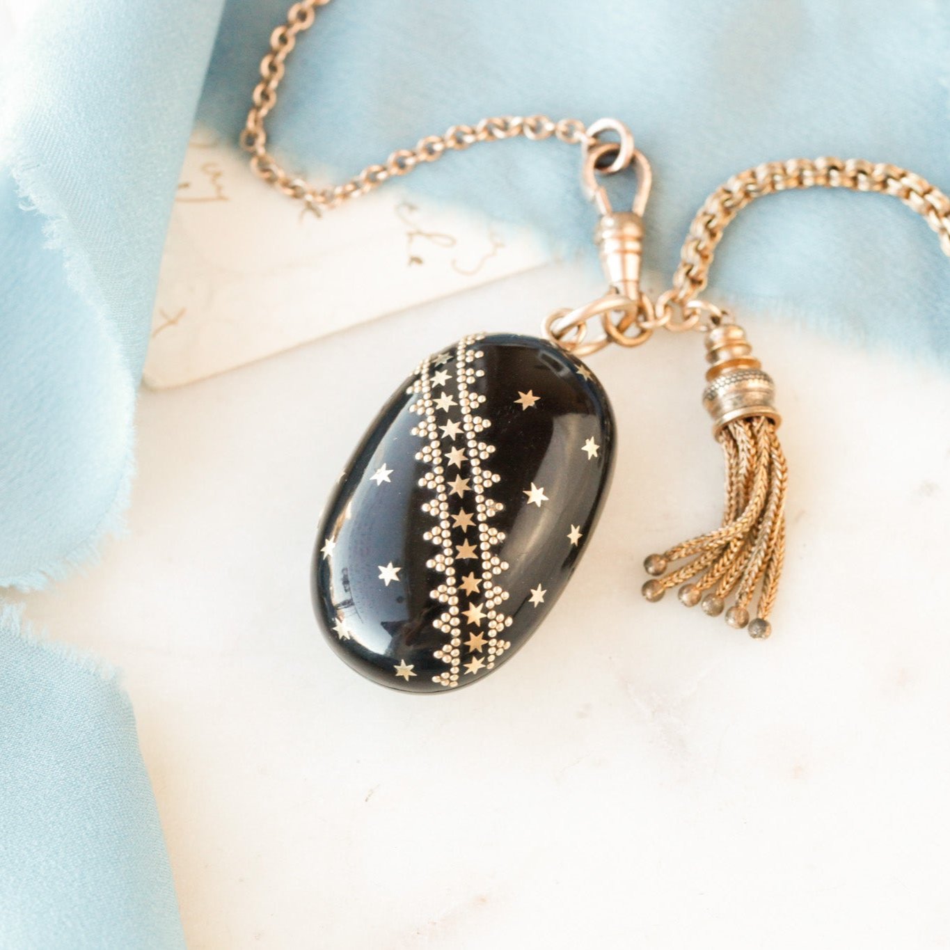 Pique Tortoiseshell Tasseled Locket