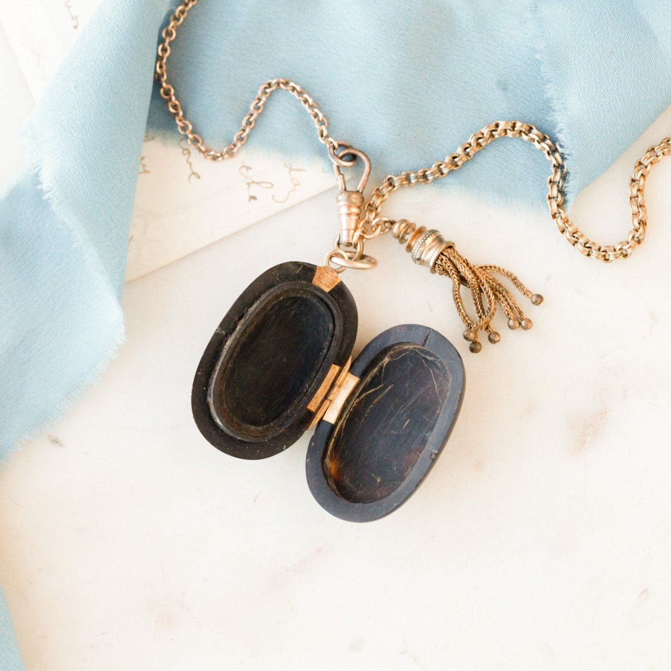 Pique Tortoiseshell Tasseled Locket