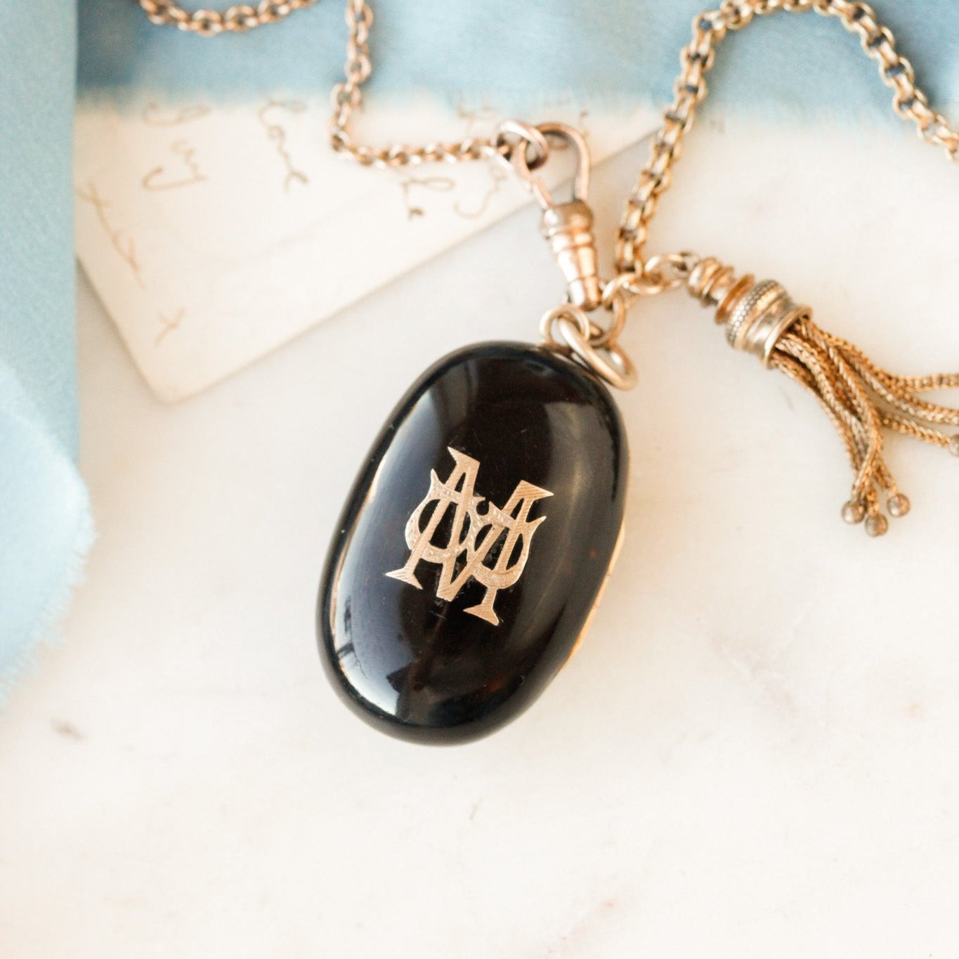 Pique Tortoiseshell Tasseled Locket