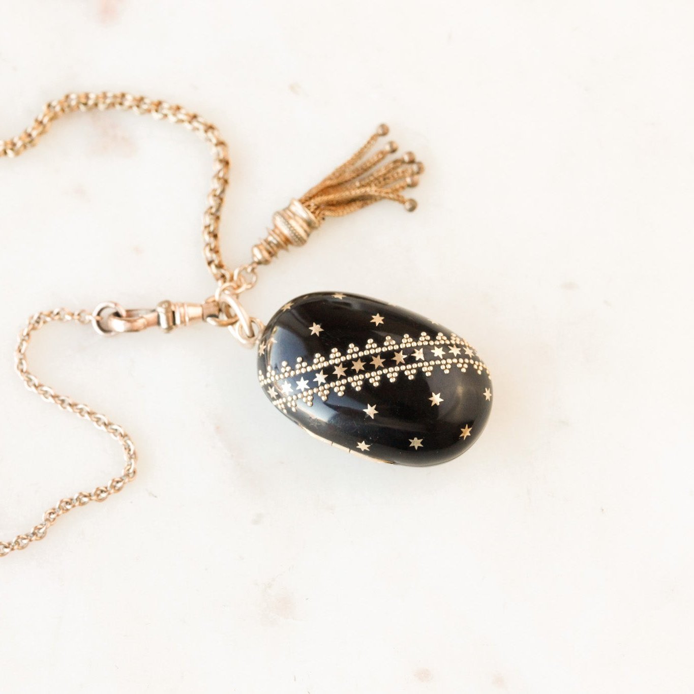 Pique Tortoiseshell Tasseled Locket