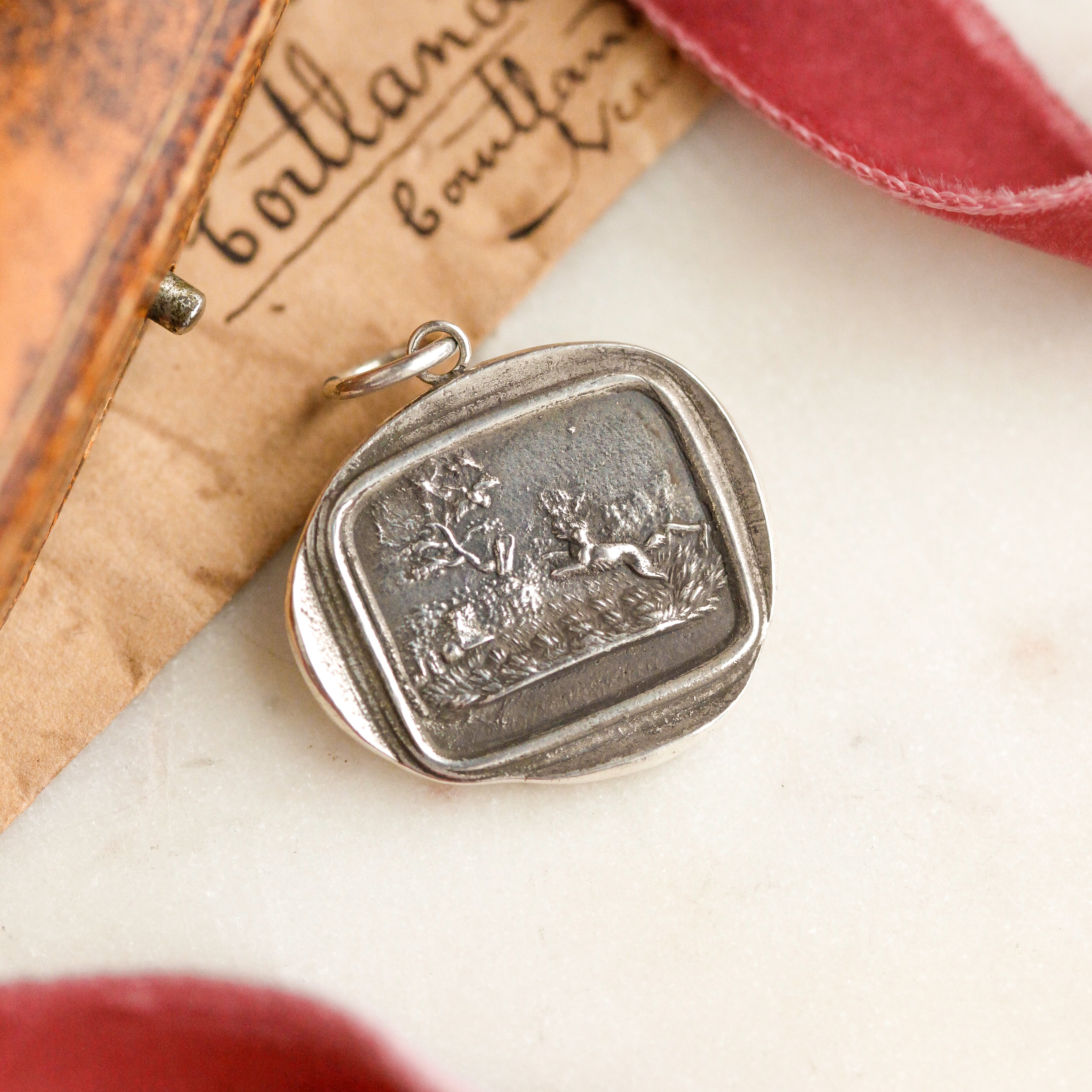 "Fair Game" Silver Charm
