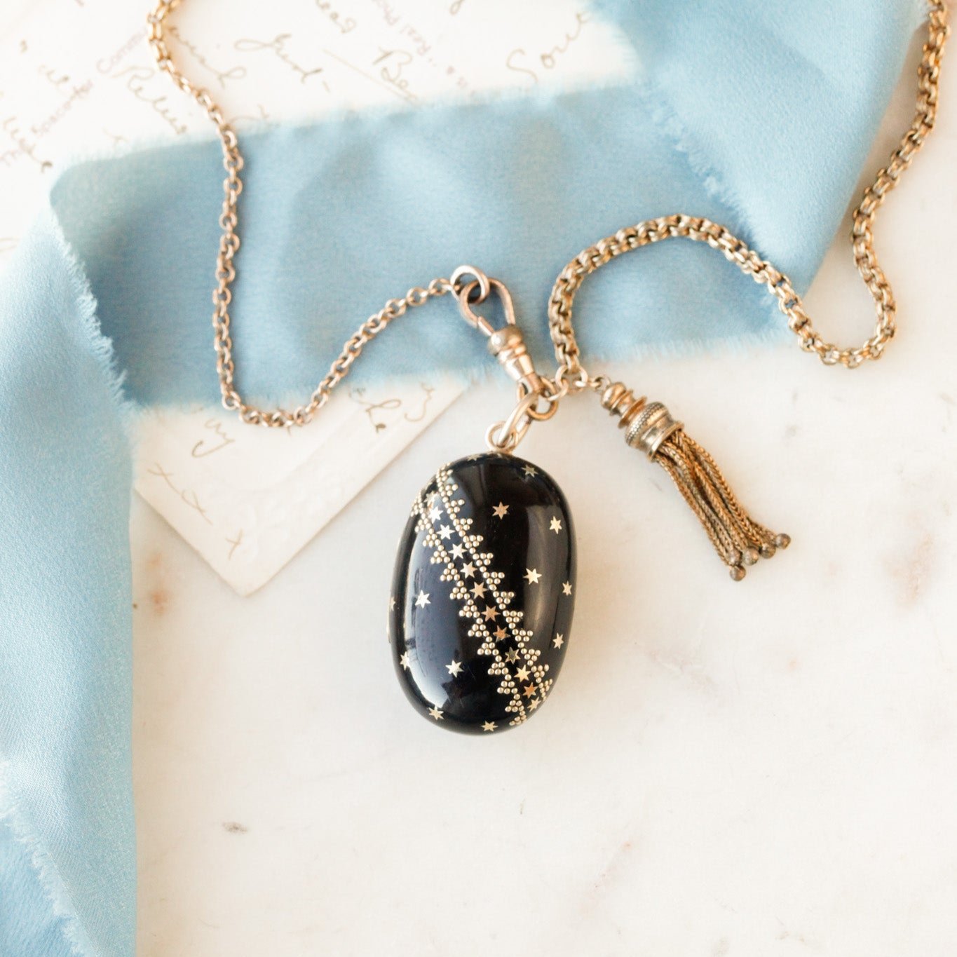 Pique Tortoiseshell Tasseled Locket