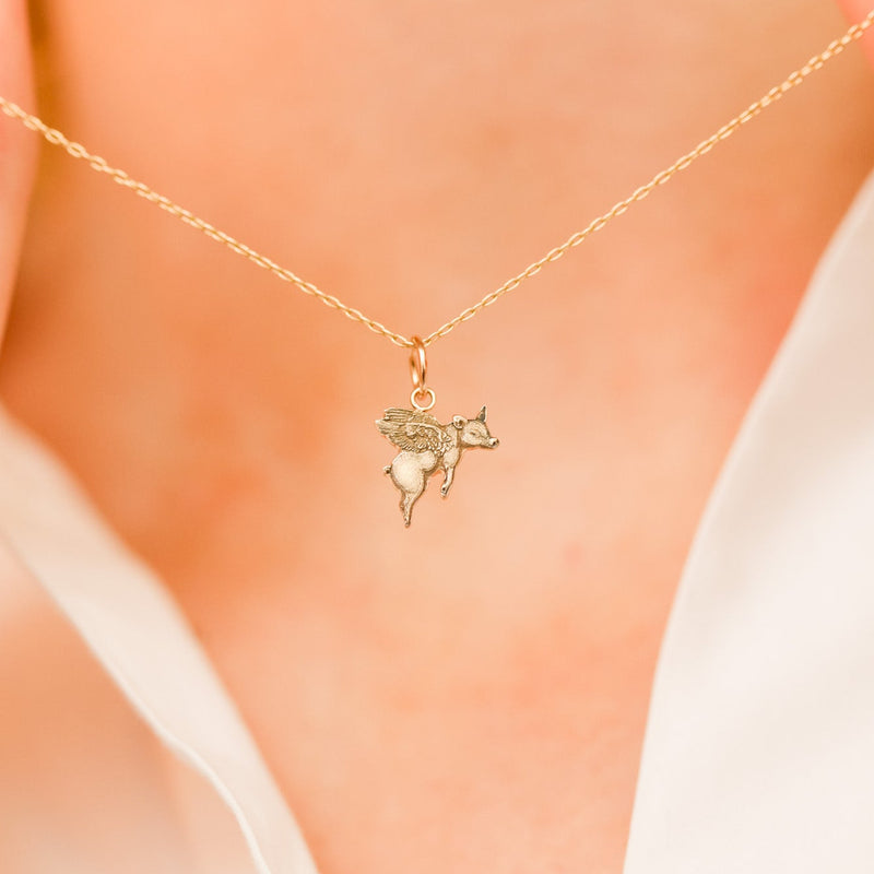 "Impossible Pig" Gold Charm
