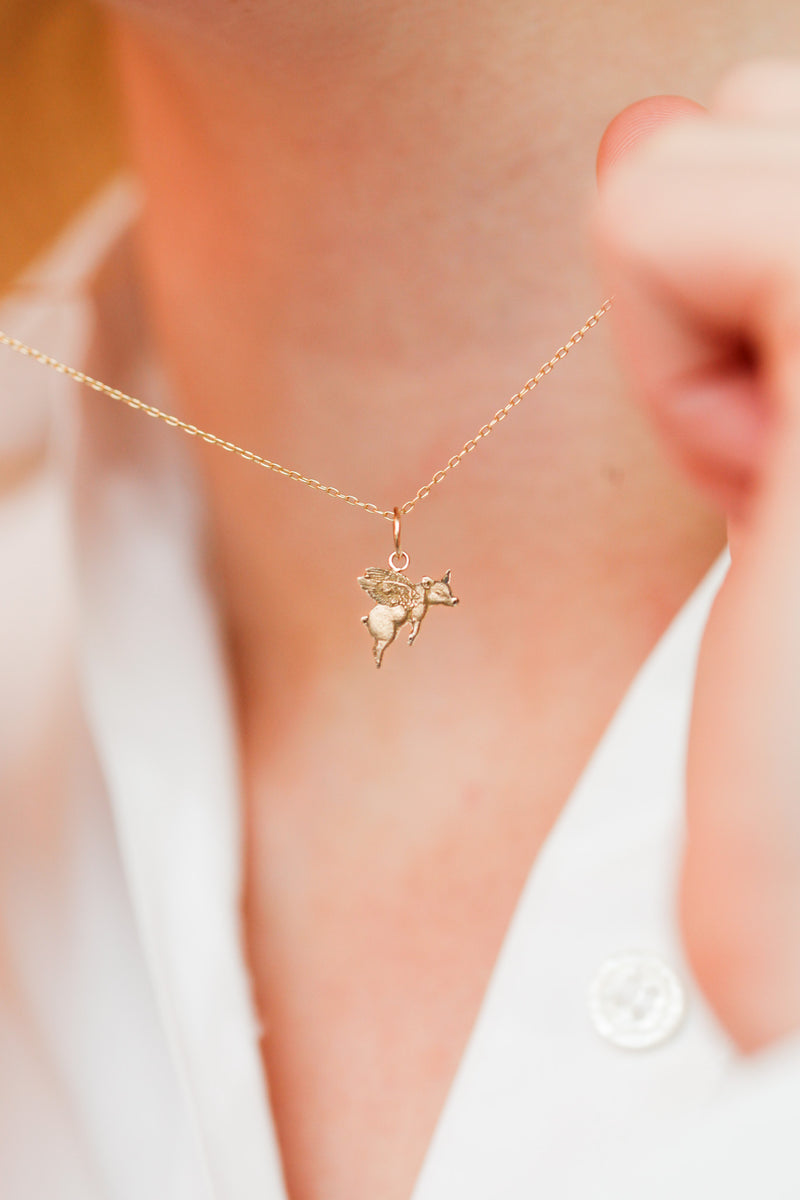 "Impossible Pig" Gold Charm
