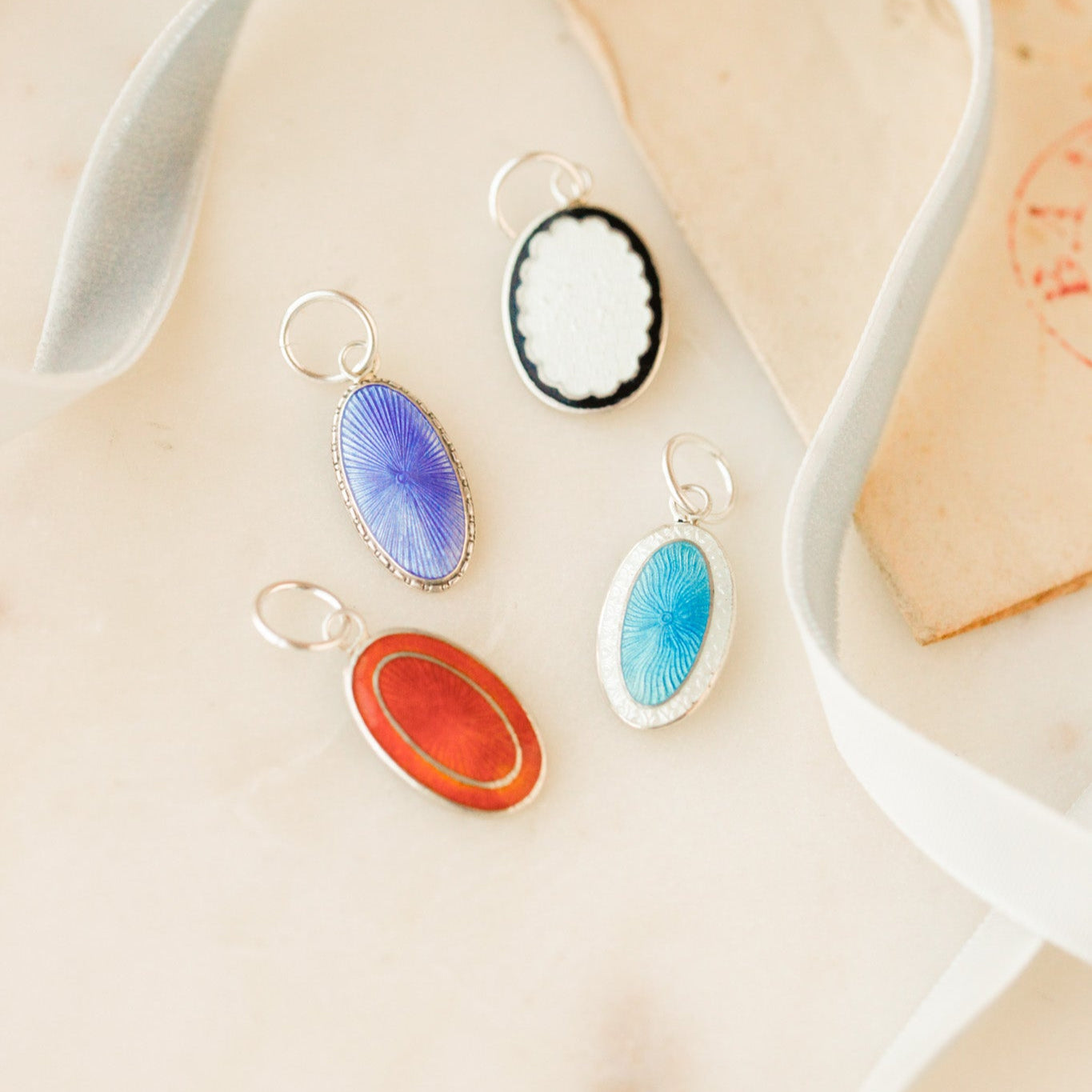 Enameled Cuff Pendants.