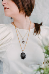 woman wearing victorian onyx mourning locket