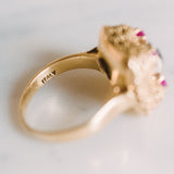 the word "ITALY" inscribed inside a gold ring