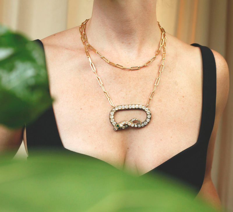woman wearing two layered necklaces